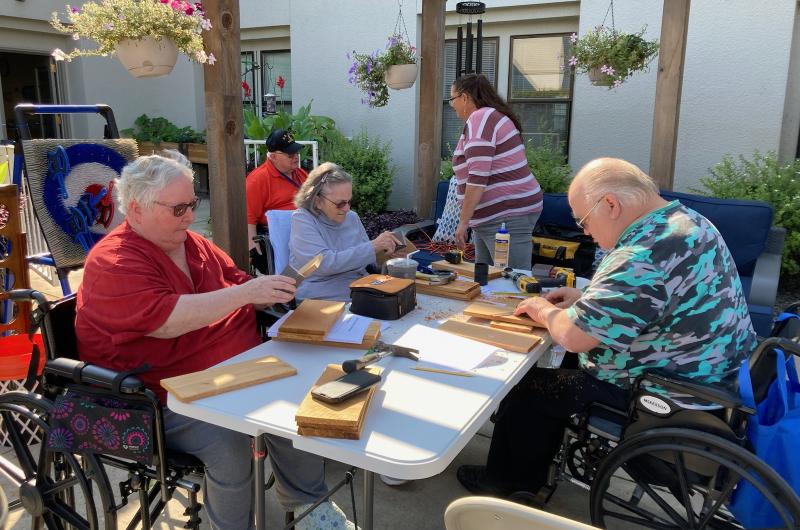 Residents enjoying woodworking at Spokane Veterans Home