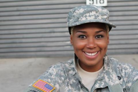 Female service member smiling